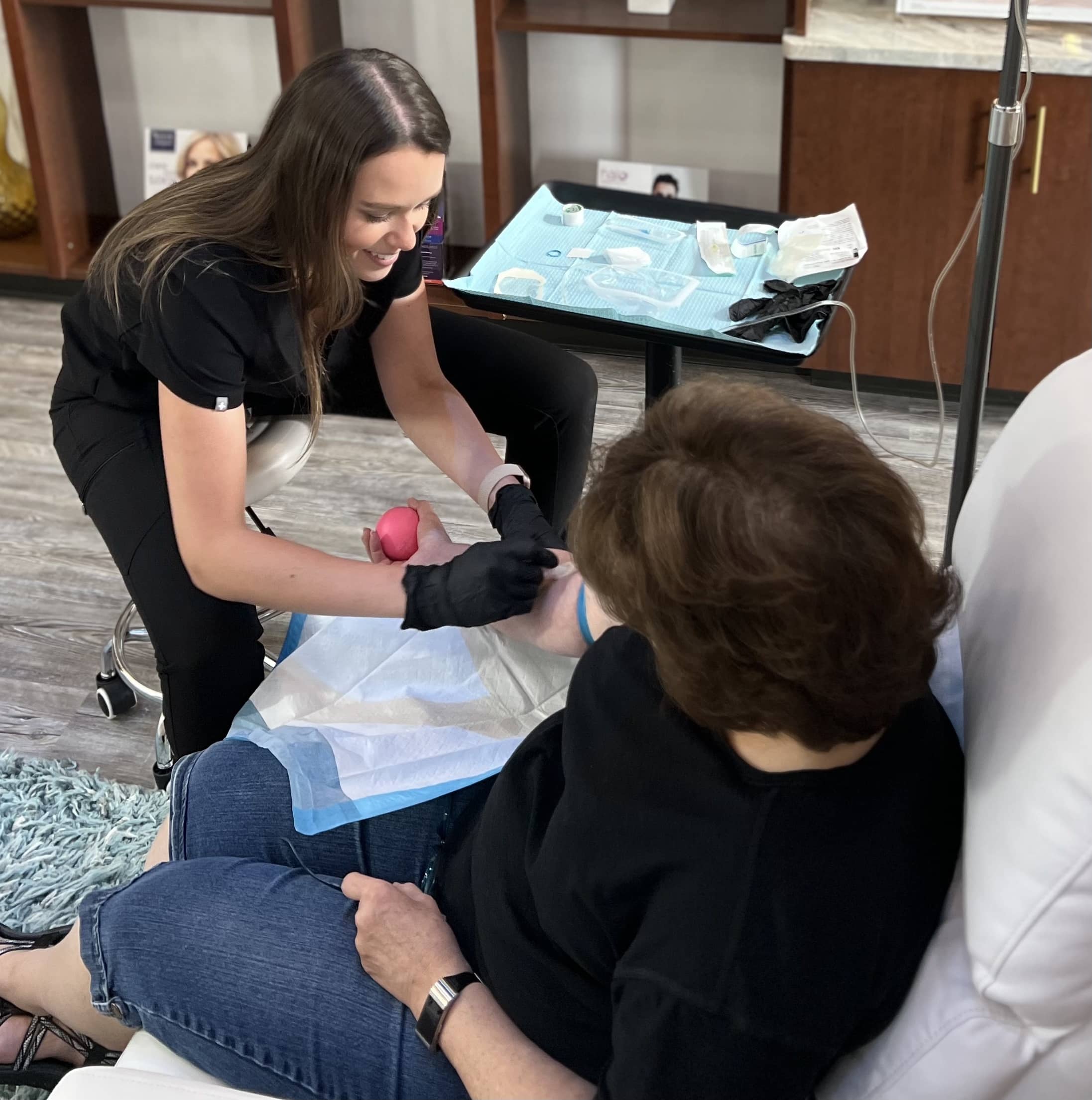 Lexi performs IV therapy on a patient